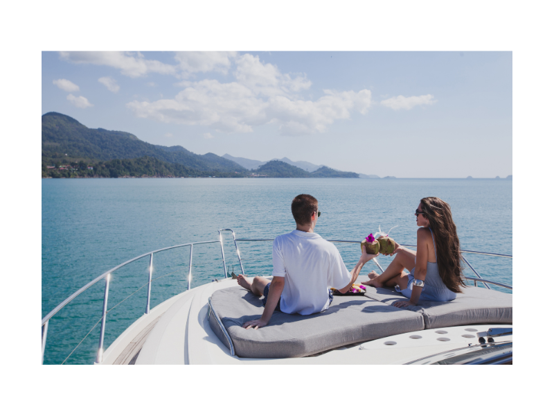 Top 8 Questions Before Booking a Yacht Charter Guide, two people on a yacht pic